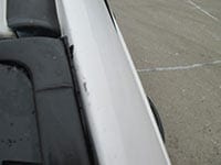 Damage done to the windshield edge on a car