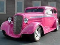 An antique pink car